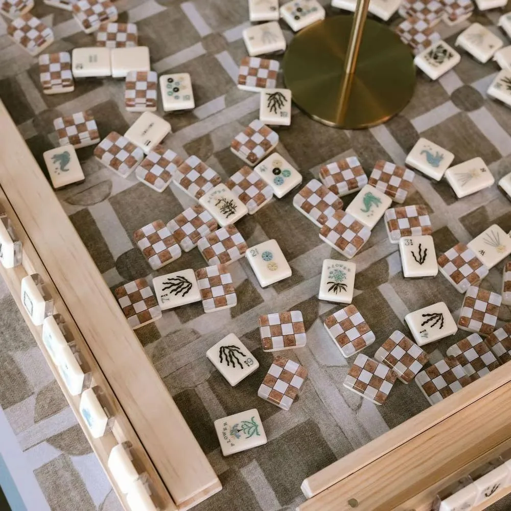 Mahjong tiles on a wooden table