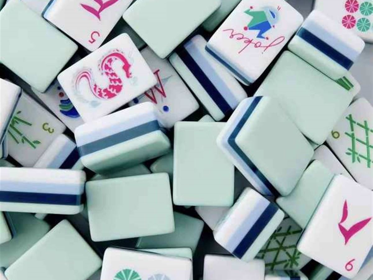 Travel Mahjong set with sage and navy color palette